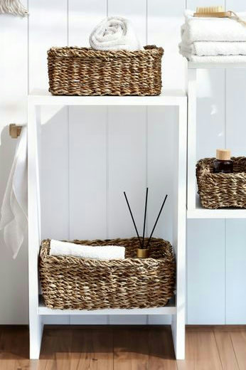 Stylish bathroom storage with wicker baskets on shelves, adding a natural touch to home decor.